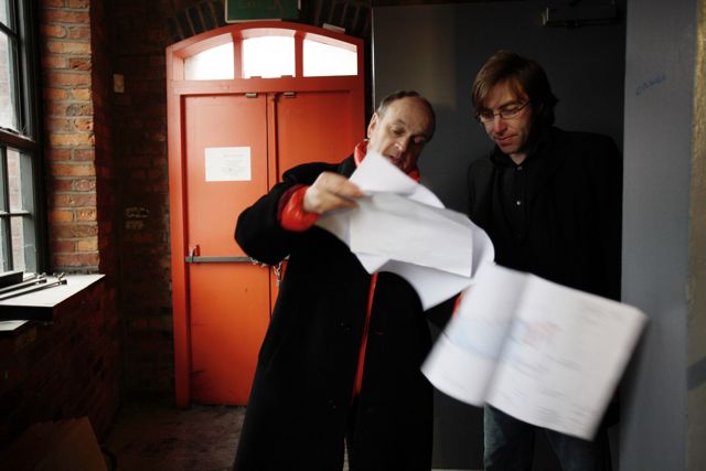 Ben Kelly and Aaron Miller examine the plans for FAC 251 The Factory; [photo credit: Kevin Cummins]