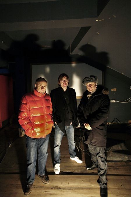 Ben Kelly, Aaron Miller and Peter Hook inside FAC 251 The Factory; [photo credit: Kevin Cummins]