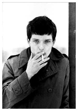 Joy Division / Ian Curtis - Hulme, Manchester, 6 January 1979; image by Kevin Cummins taken from 'Joy Division by Kevin Cummins'
