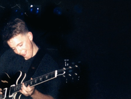 New Order live at FAC 51 The Hacienda 1983-85 - Bernard enjoys hitting the right chord!; [photo credit: Tim Sinclair]