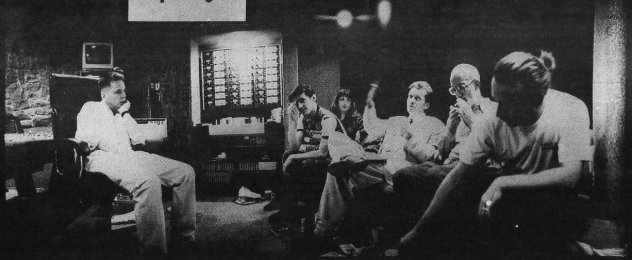 Tony Wilson (waving arms) explains his plan for world domination to New Order...