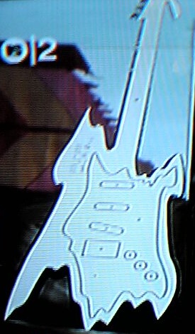 Peter Saville's guitar cut-out giveaway for the UK PSP launch; detail of guitar as featured on Zane Lowe's Gonzo show on MTV2